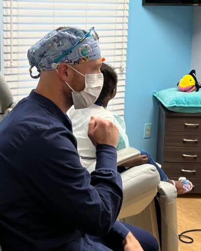 Dr. Milo and young boy in exam room at Front Row Pediatric Dentistry